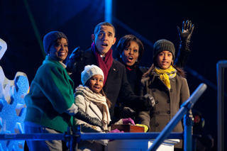 President Barack Obama, with mother-in-law Marian Robinson, daughters Sasha and Malia, and first lady Michelle Obama, lights the National Christmas Tree on Dec. 9, 2010. Chuck Kennedy